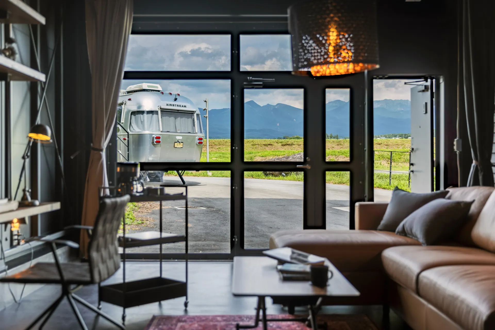 The Yatsugatake mountains and an Airstream seen from the living room